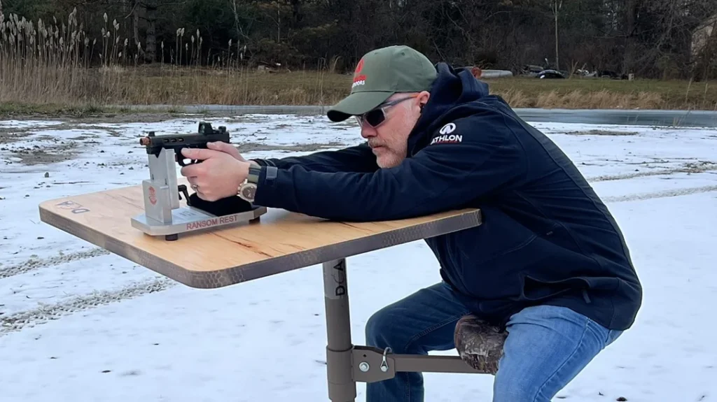 The author zeroing the Glock 17 build with the DOA Shooting bench and Ransom Rest shooting rest.