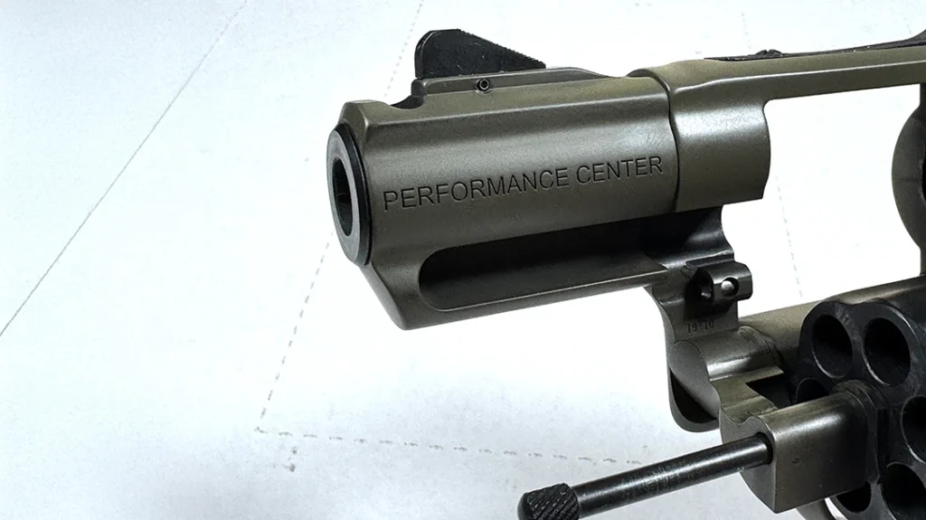 Smith replaced the ejection rod locking pin with a crane-mounted ball detent.