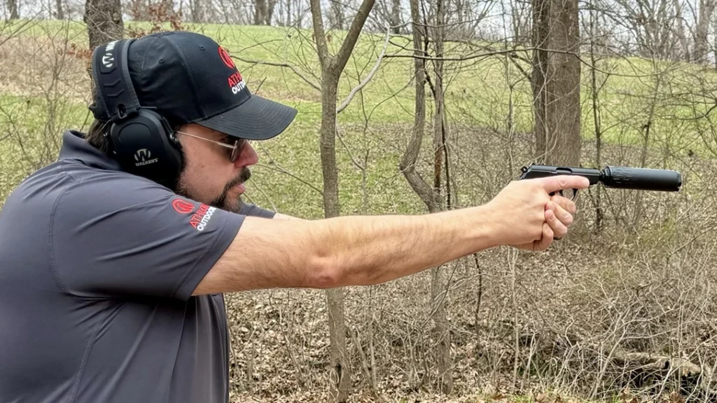 The Author shooting .32 AUTO through a suppressed Walther-made PPK/S.