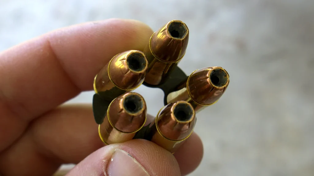 Moon clips are flat, spring-steel units with semi-circular recesses on the outside and a solid interior. The recesses hold the ammunition by a groove in the case head.