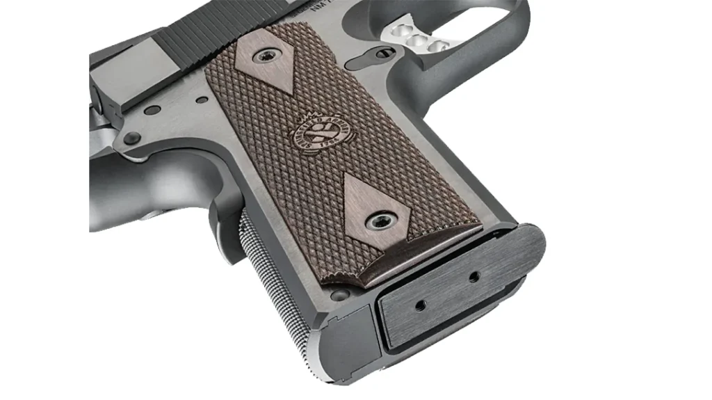 The Springfield Armory Garrison Target pistol has checkered thinline wood grips with a double-diamond pattern.